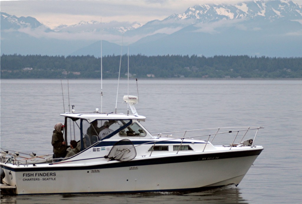 Fish Finders Seattle Fishing Charters- a fishing boat with some fishermen