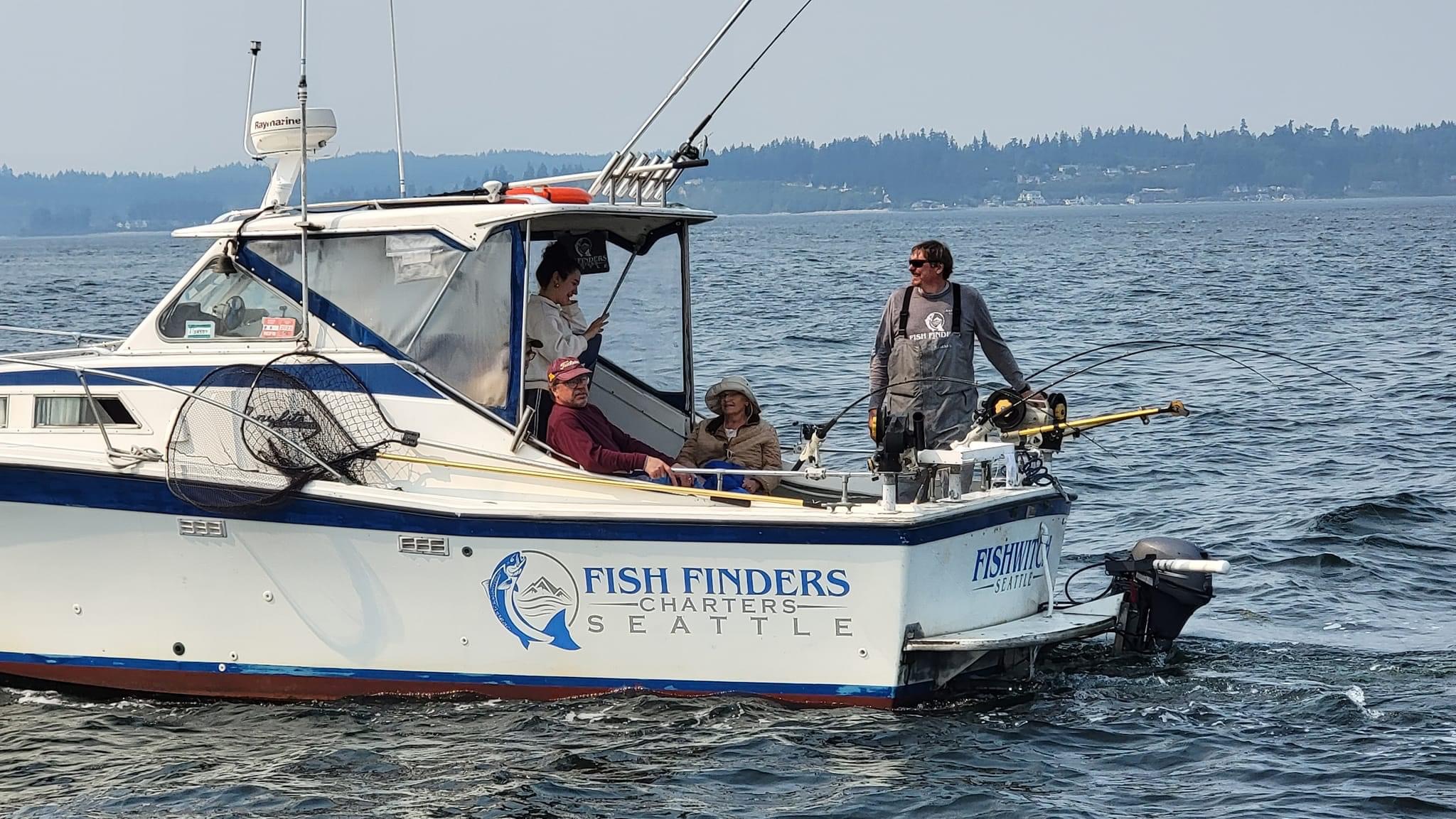 Fish Finders Seattle Fishing Charters- Four man sitting on a Boat