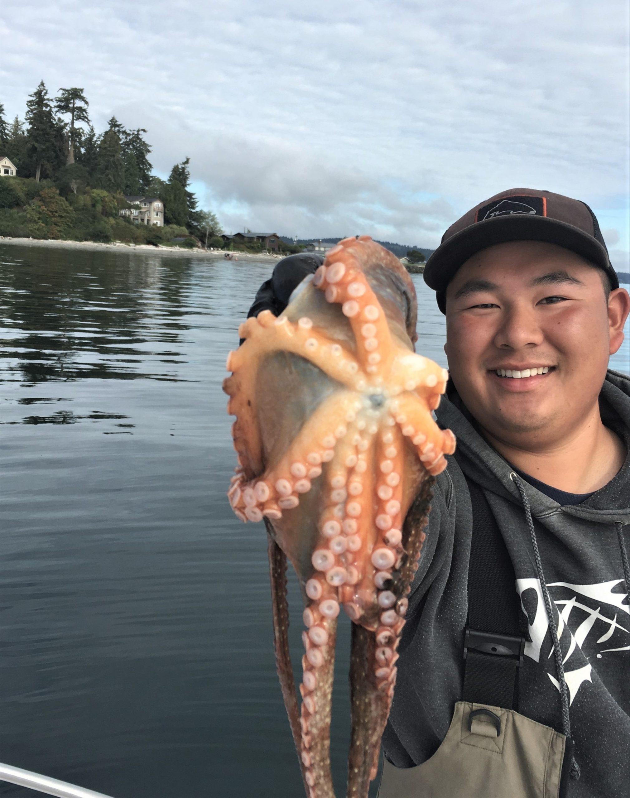 Fish Finders Seattle Fishing Charters- A man with an Octopus