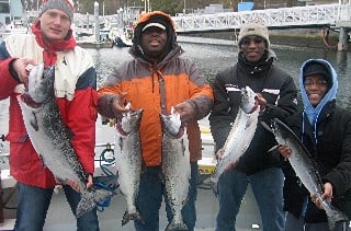 Fish Finders Seattle Fishing Charters- group friends fishing a fish